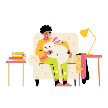 A child with curly hair is sitting on a cozy armchair that has a patterned fabric. The child is wearing colorful pajamas and is hugging a fluffy white bunny, which has big ears and soft fur. The armchair is positioned next to a small side table with a stack of children's books and a warm blanket draped over the side. The atmosphere is warm and inviting, with a gentle lamp creating a soft glow in the room.