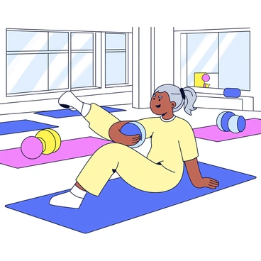 An elderly person sitting on a yoga mat in a bright, spacious community center. The person has gray hair tied back and is wearing a comfortable light-colored outfit. They are engaged in modified Russian twists, twisting their torso to the right while holding a small exercise ball. Other exercise mats and some colorful fitness equipment are visible in the background. Sunlight streams in through large windows, illuminating the scene.