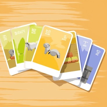 A wooden table with a smooth surface displays a spread of colorful resource cards representing Catan's resources. The cards are arranged in an overlapping pattern, showcasing vibrant colors like green for wood, yellow for wheat, brown for brick, blue for sheep, and gray for stone. Each card features detailed illustrations of the respective resources, such as trees for wood, fields for wheat, and bricks. The table's grain is visible, adding texture to the scene, while a soft light casts gentle shadows on the cards, enhancing their brightness and clarity.