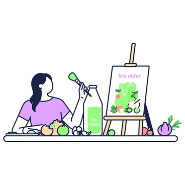 An artist is seated at a wooden table, focused on painting a still life arrangement. On the table, there is a clear glass bottle labeled "fire cider" positioned prominently at the center. Surrounding the bottle, various ingredients are scattered, including fresh ginger root, garlic cloves, and bright citrus fruits such as oranges and lemons. There are also sprigs of herbs like rosemary and thyme placed nearby. The artist, a woman with long hair pulled back, holds a brush in her right hand and is captured mid-stroke on a canvas that mimics the layout of the still life. A palette filled with paint colors rests on the table beside her, and a small easel supports the canvas. The scene is well-lit, showcasing the details of the ingredients.
