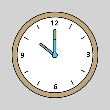 A wall clock with a circular wooden frame. The face of the clock is white with simple black numbers marking the hours. The hour hand is represented by a blue toothbrush, and the minute hand is represented by a green toothbrush. Both toothbrushes are positioned at an angle, pointing towards the numbers on the clock face. The clock is mounted on a plain wall, which is painted light gray.