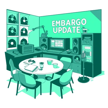 A teal radio studio filled with various equipment and microphones. Against the wall, there is a large sign that reads "Embargo Update Today" in bold white letters. The studio features soundproof panels and shelves lined with vinyl records. A round white table is positioned in the center, surrounded by chairs. On the table, there are cups and notebooks scattered about, ready for the upcoming announcement. The atmosphere is busy, hinting at preparations for a live broadcast.