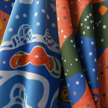 A close-up view of intricate digital textures and patterns specifically designed for 3D clothing. The image features a variety of geometric shapes and abstract motifs in vibrant colors, including blues, reds, and greens. The textures exhibit a blend of smooth and rough surfaces, with some areas showing glossy finishes while others have a matte appearance. The intricate detailing highlights the complexity of the patterns, showcasing how they would look on fabric. Subtle lighting enhances the depth and dimension of the textures, creating an engaging visual experience.