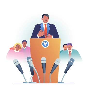 A newly elected official with light skin and short dark hair is standing at a wooden podium delivering a speech. The official is wearing a navy blue suit with a white shirt and a red tie. The podium is adorned with a small emblem on the front, signifying the official's position. Surrounding the podium are multiple microphones, some with black and silver designs, capturing the speech. In the background, a small group of people is seated, attentively listening to the official. The atmosphere is filled with anticipation and focus as the speech is being delivered.