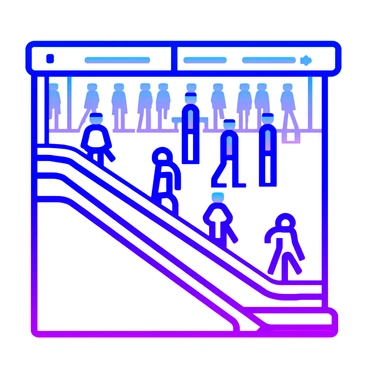 An escalator leading down to a busy metro station with numerous people walking briskly in various directions.