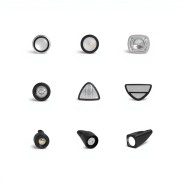 An array of various car headlights arranged in a grid pattern. The headlights include a classic round headlight with a chrome bezel, a rectangular halogen headlight with a clear lens, a sleek LED headlight with a sharp design, and a modern projector headlight with intricate detailing. Each headlight is displayed at an angle to emphasize its shape and features. The grid layout allows for clear visibility of each headlight, showcasing the differences in design and technology from classic to contemporary styles.