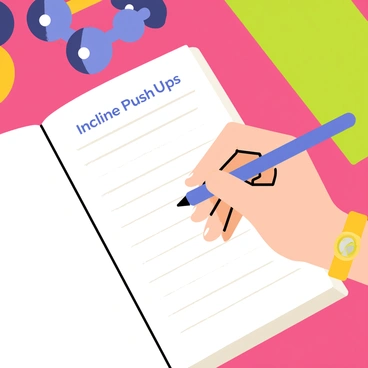 A close-up of a hand holding a blue pen, writing on a page of a fitness journal. The journal features a grid design with labeled sections for workout notes. The visible text includes the words "Incline Push-Ups" in clear, bold letters. The hand is positioned over the journal, with neatly manicured nails and a wristwatch visible. In the background, a colorful gym environment can be hinted at with blurred fitness equipment like dumbbells and a yoga mat.