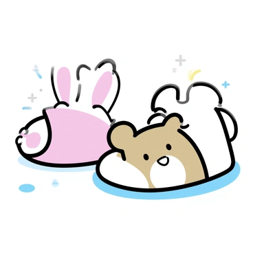 A pair of small, chubby baby feet is visible, sitting on a light-colored surface. Each foot is adorned with soft, fluffy animal-themed slippers. One slipper resembles a bunny with floppy ears and a pink nose, while the other mimics a teddy bear with round ears and a smiling face. The slippers are pastel-colored, enhancing the playful appearance of the baby feet. The background is softly blurred, ensuring the focus remains on the adorable feet and slippers.