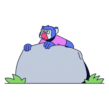 A mandrill with a colorful face peering over a large gray rock. The mandrill has bright blue and red markings on its face, giving it an inquisitive expression. Its eyes are wide open, filled with curiosity, as it looks at something in the distance. The rock is surrounded by a few patches of green grass. The background includes a hint of foliage, completing the natural setting.