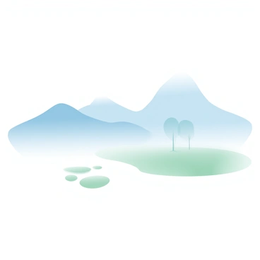 Misty mountains rise in the background, their peaks just barely visible through a thick layer of early morning fog. The fog drapes over the mountains like a soft blanket, creating a sense of depth and mystery. In the foreground, patches of green grass are peeking through the mist, while a few silhouettes of trees emerge faintly, their outlines softened by the atmospheric conditions. The overall scene is tranquil, with the muted colors of the landscape blending seamlessly into each other.