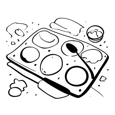 An artist's palette placed on a wooden table, with various blobs of butter in different shapes and sizes arranged in the wells. Each blob of butter has a unique texture, some creamy and smooth while others are more solid and chunky. A palette knife rests alongside the palette, and a few butter smears extend outward from the blobs, suggesting recent use. The surrounding area includes a small tub of butter and a crumpled piece of parchment paper.