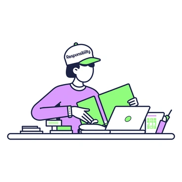 A person is sitting at a desk, wearing a hat labeled "Responsibility." The hat is prominently displayed atop their head as they focus on organizing a stack of documents spread out in front of them. The documents are variously sized, some neatly stacked while others are partially spread out. The individual is also holding a green binder in their left hand, while their right hand is reaching towards a pen resting on the desk. A laptop is open nearby, displaying a spreadsheet of information.