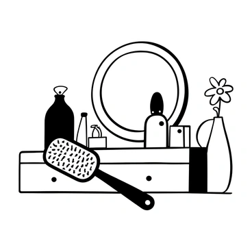 A hairbrush and a hand mirror elegantly placed on a vanity surface. The hairbrush is designed with intricate patterns on the handle, resting beside the hand mirror, which has a delicate frame. The vanity has a polished appearance, reflecting the soft lighting that creates gentle shadows. Various beauty products can be seen in the background, enhancing the overall composition, while a small vase with a single flower adds a touch of refinement to the scene.