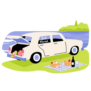 A classic wedding car in white color parked near a calm lake, with its trunk open, revealing decorative floral arrangements and a "Just Married" sign. Nearby, there is a picnic setup with a checkered blanket spread out on the grass, featuring a basket filled with fruits and pastries. A bottle of sparkling beverage rests beside a couple of wine glasses. In the background, gentle ripples on the lake reflect the blue sky and surrounding greenery, enhancing the tranquil atmosphere.