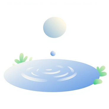 A smooth, round stone is shown mid-air, just above the surface of a calm pond. Below it, the water is a clear blue, reflecting soft light. The moment the stone touches the water, it creates a series of gentle ripples that radiate outward. The ripples are delicate and evenly spaced, gradually diminishing in size as they move away from the point of impact. Small patches of green vegetation are visible along the pond's edge, adding contrast to the serene scene. The overall atmosphere is tranquil and focused on the interaction between the stone and the water.