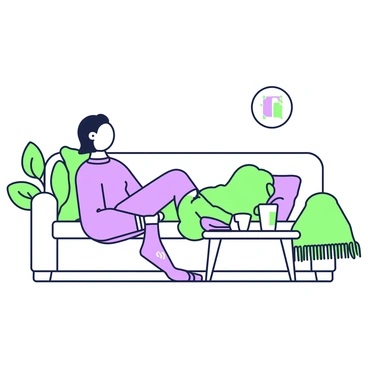 A person is sitting comfortably on a couch in a living room. They are wearing smart socks designed to track foot health. The socks are snug and feature small sensors. The individual is relaxed, with one leg crossed over the other. A coffee table in front of them holds a laptop and a cup. A warm blanket is draped over the arm of the couch. A plant can be seen in the corner, adding a touch of greenery to the scene.