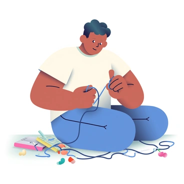 A person trying to untangle a mess of earbuds