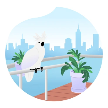 A cockatoo perched on a modern urban balcony with a city view