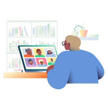 A person with light brown hair is sitting at a wooden desk, attending a virtual meeting on a silver laptop. They are wearing a blue sweater and glasses. The laptop screen displays multiple faces in small windows, each showing a different participant. The background consists of a bookshelf filled with books and a few decorative potted plants. A notepad and a pen are placed next to the laptop on the desk. The person is leaning slightly forward, engaging with the meeting.