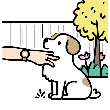 A hand with a light brown wristwatch is gently petting a fluffy dog with white fur and light brown patches. The dog is sitting on soft grass, looking up with a happy expression. The backyard is filled with green plants and a few colorful flowers, bathed in warm sunlight. A wooden fence is in the background, partially shaded by the vibrant leaves of a nearby tree.