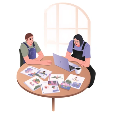 An illustrator and a client are sitting at a round wooden table. The illustrator, positioned on the left, has light skin and short brown hair. They are wearing a gray t-shirt and denim overalls. The client, on the right, has medium skin and shoulder-length black hair, dressed in a blue blouse and black trousers. Both are focused on a collection of colorful illustrations spread out on the table in front of them. The illustrations feature vibrant characters and landscapes. A laptop displaying digital artwork is open next to the illustrations, and a steaming cup of coffee is placed beside the client. A large window in the background lets in natural light, illuminating the scene.