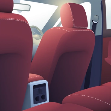 A close-up view of a luxurious car interior reveals rich, dark brown leather seats. The leather has a soft sheen, highlighting the high-quality material. Elegant white stitching runs along the seams, creating a refined contrast against the leather. The seats are plush and inviting, with subtle curves that enhance their comfort. In the background, the soft glow of ambient lighting adds a warm touch to the luxurious atmosphere.