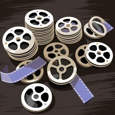 Stacks of vintage film reels in various sizes are scattered across a dark wooden table. The film reels have a worn appearance, showcasing the metallic spools and black film. Some reels are upright, while others lie flat on the surface. The table's wood grain is visible, adding texture to the scene. Soft light casts subtle shadows across the reels, highlighting their details and giving the composition depth.