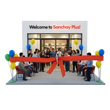 A ribbon-cutting ceremony is taking place to celebrate the opening of a new "Sanchay Plus" branch. A large red ribbon is prominently displayed across the entrance, held in place by two oversized scissors. Colorful balloons in various shades of blue, yellow, and green are tied to nearby chairs and flanking the entrance. A diverse crowd of people, including men and women of different ages, are gathered around, some taking photos with their smartphones. A banner above the entrance reads "Welcome to Sanchay Plus!" in bold letters. The atmosphere is festive, filled with excitement and anticipation.