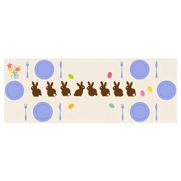 A beautifully set table with chocolate bunnies as the centerpiece