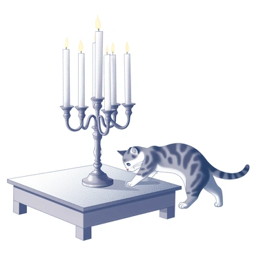 A menorah on a low table with a curious cat playing nearby
