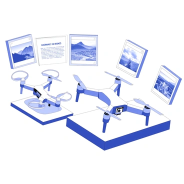 A display section showcases several drones designed for aerial photography. Each drone is equipped with a camera mounted at the front, featuring a gimbal for stabilization. The drones are positioned on sleek pedestals, highlighting their aerodynamic shapes. Above each drone, there are sample aerial photographs displayed in frames, depicting landscapes and cityscapes captured from unique angles. The photographs vary in perspective, showing details of forests, mountains, and urban environments. The background features signage describing the specifications and features of each drone.