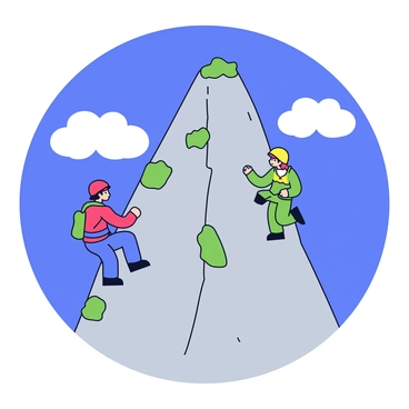 A steep cliff rises sharply, with rugged gray rocks and patches of greenery clinging to the surface. Two climbers are in action, one ascending on the left side and the other on the right. The climber on the left has a bright red helmet and blue climbing gear, while the climber on the right wears a yellow helmet and green equipment. Above, the sky is a clear, vibrant blue with a few fluffy white clouds scattered throughout.