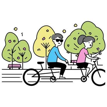 A blind person, wearing dark sunglasses, is sitting on the back seat of a tandem bicycle. The person has short hair and is dressed in a light blue shirt and dark pants. In the front seat, a guide is pedaling, wearing a red T-shirt and black shorts. They are riding through a park filled with green trees and blooming flowers. The path is paved, and there are a few benches and people walking in the background. The guide is smiling and pointing ahead while the blind person is listening attentively.