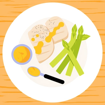 A white plate filled with grilled chicken breast slices arranged neatly. Bright green asparagus spears are placed alongside the chicken. A generous drizzle of golden honey mustard glaze glistens over the chicken and asparagus. A sprinkle of black pepper is visible on top, and a small dish of extra honey mustard glaze is placed next to the plate. The background is a simple wooden table, enhancing the focus on the dish.