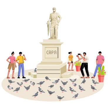 A historic statue stands proudly in a sunny Capri piazza, featuring intricate details and a classical design. The statue is adorned with ornamental elements and is positioned on a stone pedestal. Around the statue, numerous pigeons are perched and pecking at the ground, their feathers varying in shades of gray and white. Tourists gather nearby, some taking photographs while others are chatting and enjoying the vibrant atmosphere. Colorful flowers bloom in pots along the edges of the plaza, adding a lively touch to the scene.