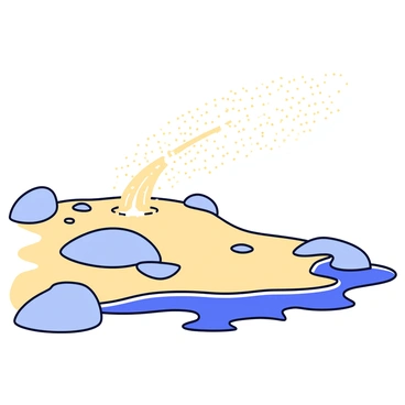 A gust of wind blowing across a rocky beach, scattering fine grains of sand into the air. The wind creates small clouds of sand that settle onto the uneven surface of the rocks. The beach features a mix of smooth and jagged stones, with patches of wet sand glistening in the sunlight. The sky is clear and bright, contrasting with the earthy tones of the beach and rocks.