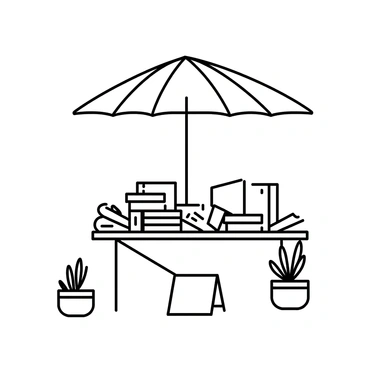 An outdoor bookstand is set up on a wooden table with a large, "colorful umbrella" providing shade overhead. The stand showcases an assortment of "second-hand books" neatly arranged in stacks, with spines facing outward. The table is surrounded by a few potted plants, adding a touch of greenery. There is a soft breeze gently rustling the pages of the open books, which are spread out for display. A small sign sits on the table, inviting passersby to browse the collection.