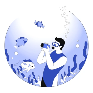 A diver is submerged in the ocean, wearing a wetsuit and a diving mask. The diver is holding an underwater camera, aiming it at a group of fish swimming nearby. The fish are various shapes and sizes, with distinct features like fins and tails. Surrounding the diver are bubbles rising towards the surface. The underwater environment is filled with coral formations that provide a habitat for the fish. Sunlight filters down from above, illuminating the scene. The diver is focused on capturing the moment, while the fish swim playfully around.