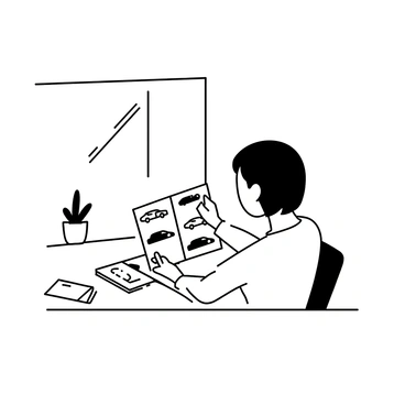 A person is seated at a table, intently flipping through a glossy car brochure. The brochure is open to a page showcasing several sleek car models. The person's right hand is holding a corner of the brochure as they examine the images. The person has short hair and is wearing a casual shirt. The table has a few scattered brochures and a small potted plant. Natural light is coming from a nearby window, creating soft shadows on the table.