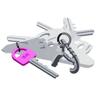 A close-up view of a keychain featuring a small, metallic dumbbell charm. The charm is shiny and reflects light, showcasing detailed carvings on its surface. The keys are variously shaped and made of silver, lying against a textured surface. The dumbbell charm hangs prominently from the keychain, adding a playful touch to the arrangement. The background is softly blurred to emphasize the keychain and its components.
