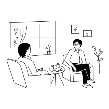 A therapist sitting in a comfortable chair, talking to a client who is sitting on a couch. The therapist has short hair and wears glasses, while the client has medium-length hair and is dressed casually. A small table between them holds a notepad and a pen. The room is filled with various framed drawings and plants. A window with drawn curtains allows soft light to enter the space. The expressions on their faces show engagement and understanding.