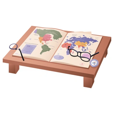 An atlas open to a colorful map of the world's continents