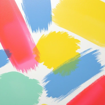 A close-up view of a canvas displaying a variety of colorful brush strokes. The strokes include vibrant shades of red, blue, yellow, and green, overlapping and blending into one another. The texture of the paint is visible, with some areas showing thick application and others being sheer. The edges of the brush strokes are soft and slightly irregular, creating a dynamic and lively composition. Light reflects off the brush strokes, highlighting their glossy surfaces and adding depth to the colors.
