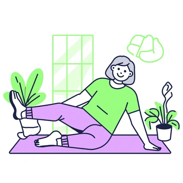 An elderly person with gray hair is sitting on a yoga mat in a bright room. They are wearing comfortable athletic clothing, consisting of a loose-fitting t-shirt and soft pants. With a cheerful expression, they are performing heel slides, extending one leg forward while the other remains bent. Sunlight streams in through a large window, illuminating the space. Potted plants are arranged in the corner of the room, adding a touch of greenery. A soft rug lies beneath the yoga mat, creating a cozy atmosphere.