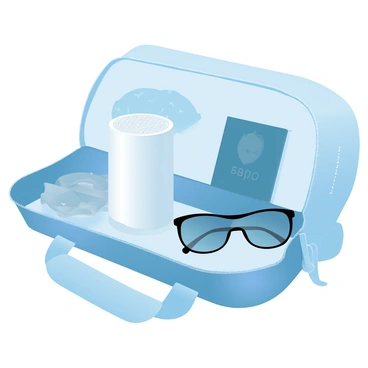 A small portable air purifier is sitting inside an open travel bag. The air purifier is compact, featuring a sleek design with a smooth surface. Next to it is a passport, partially visible, showcasing its cover with a geometric pattern. Beside the passport, a pair of stylish sunglasses is resting, with reflective lenses and a modern frame. The travel bag is filled with various travel essentials, and its fabric has a subtle texture, adding depth to the scene. The overall composition conveys a sense of readiness for travel and adventure.