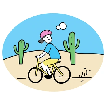 A child, wearing a blue t-shirt and a red helmet, is riding a bicycle along a sandy desert path. The bicycle is bright yellow, and the child has a focused expression on their face. In the background, there are several tall green cacti, their arms reaching out towards the bright blue sky. The sandy path is surrounded by light brown dunes, and the sun casts shadows on the ground, highlighting the child's movement.