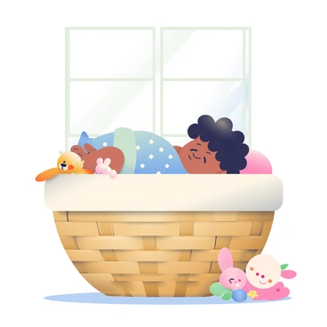 A sleeping baby with curly black hair is nestled comfortably inside a soft-padded laundry basket. The basket is woven from natural bamboo and has a light cream-colored padding surrounding the baby. The baby is wrapped in a pastel blue blanket with small white stars. The scene includes a few plush toys resting beside the baby, including a teddy bear and a soft bunny. Soft sunlight filters through a nearby window, casting gentle shadows around the basket.
