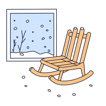 A wooden rocking chair with a natural finish, featuring a slatted back and curved rockers. The chair is positioned by a large window with a clear glass pane. Outside the window, snow is falling gently, covering the ground and creating a soft white blanket. The scene includes snowflakes drifting down and the outline of bare tree branches in the background. The light from the window casts a soft glow on the rocking chair.