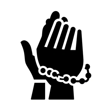 A pair of hands gently clasped in prayer with a rosary draped over the fingers.