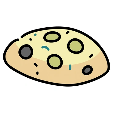 A close-up of a focaccia loaf studded with juicy black and green olives
